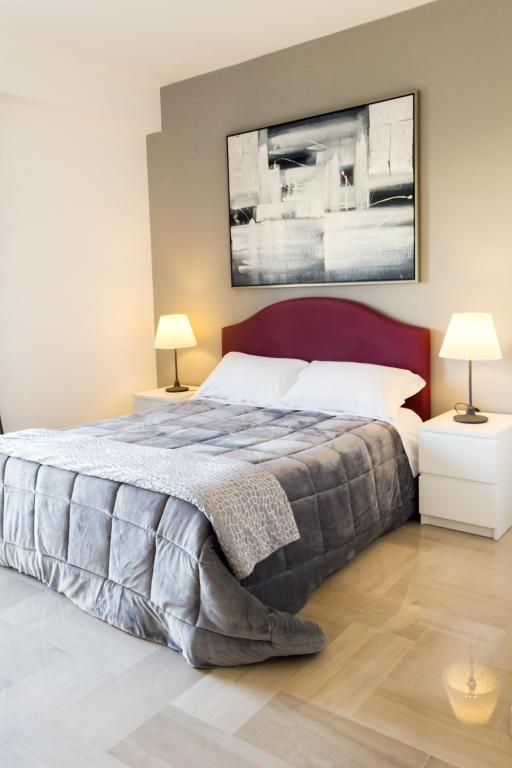 Postel nebo postele na pokoji v ubytování B&B Porta di Ponte