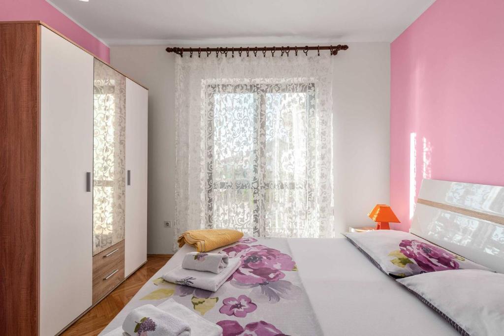 Posteľ alebo postele v izbe v ubytovaní Family Apartments Barbarella