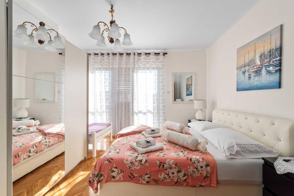 Posteľ alebo postele v izbe v ubytovaní Family Apartments Barbarella