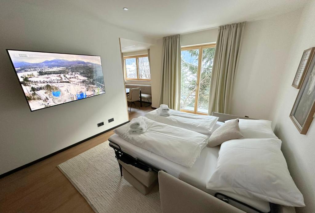 Televízia a/alebo spoločenská miestnosť v ubytovaní Chalet H Montafon