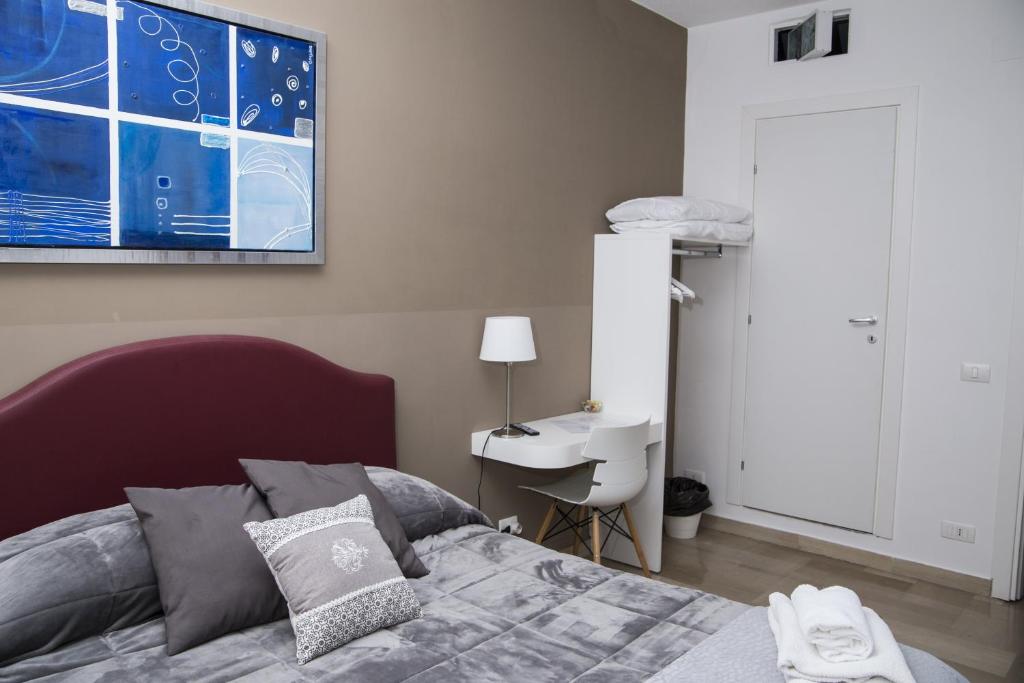 Postel nebo postele na pokoji v ubytování B&B Porta di Ponte