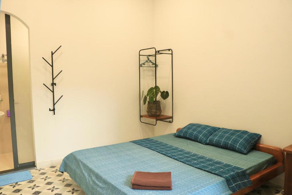Postel nebo postele na pokoji v ubytování Sea For Rest Homestay