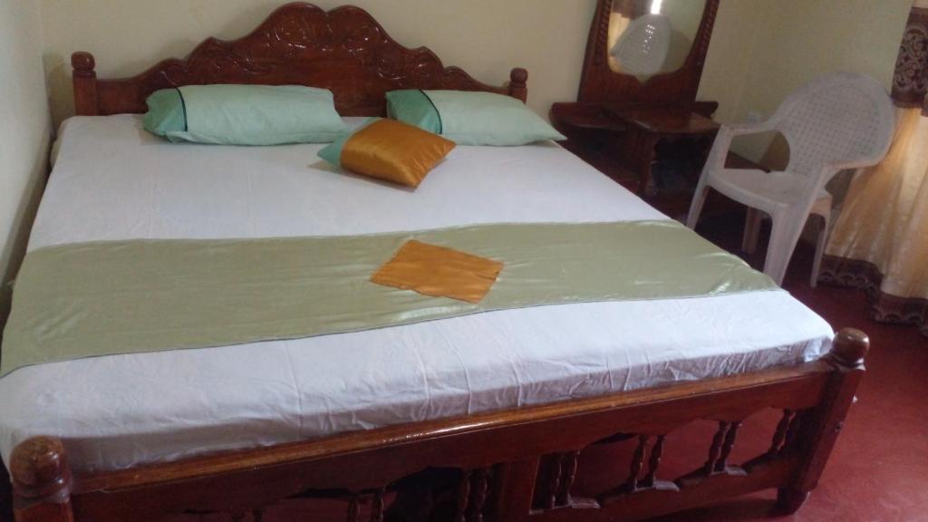 Postel nebo postele na pokoji v ubytování Haranya Homestay