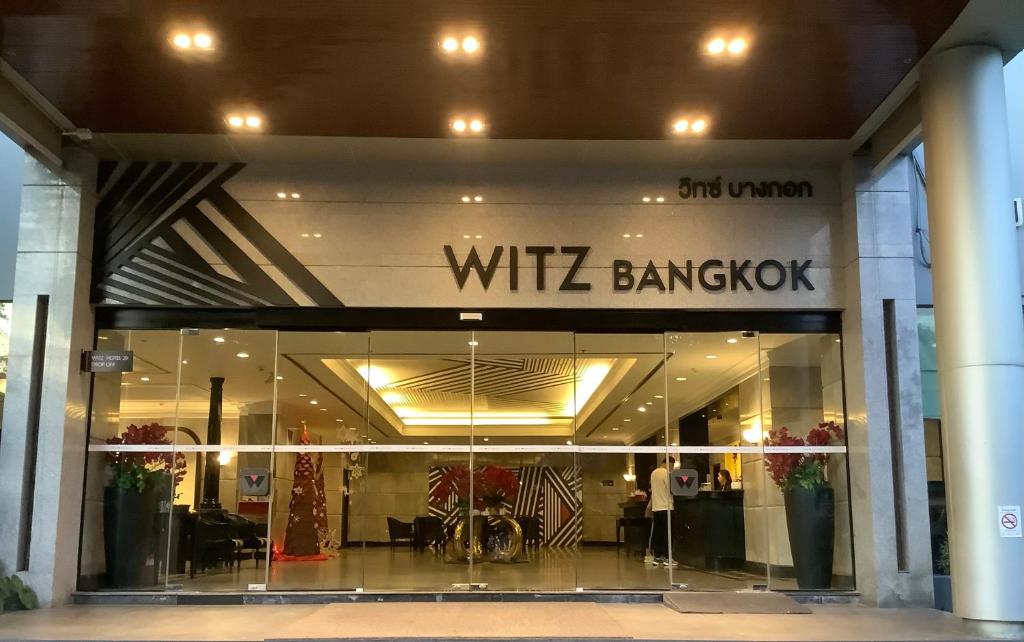 a store front of a building with a wii branch sign at Witz Bangkok Ramkhamhaeng in Bangkok
