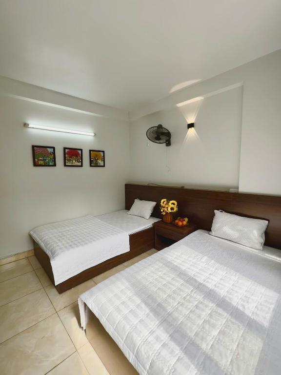 Postel nebo postele na pokoji v ubytování Noi Bai Sunflower Hotel