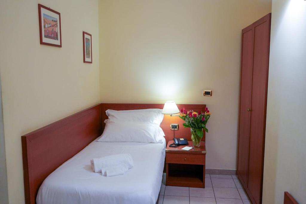 Postel nebo postele na pokoji v ubytování Hotel Adria