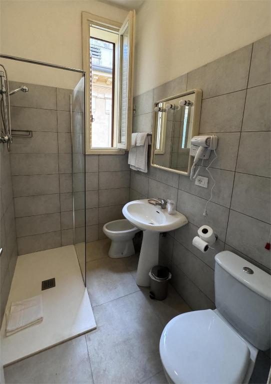 Koupelna v ubytování Hotel Ely