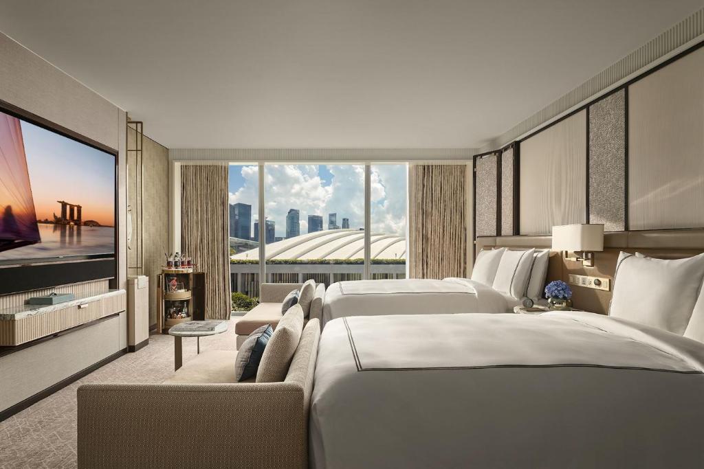 Ein Bett oder Betten in einem Zimmer der Unterkunft Marina Bay Sands