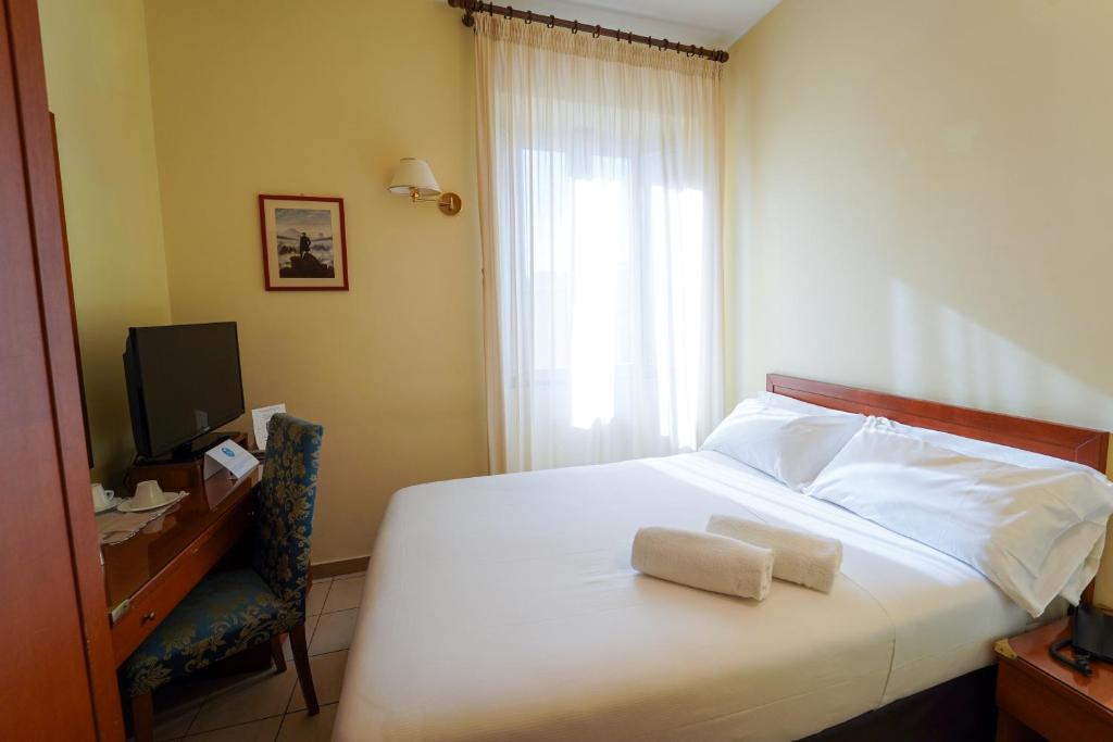 Postel nebo postele na pokoji v ubytování Hotel Adria