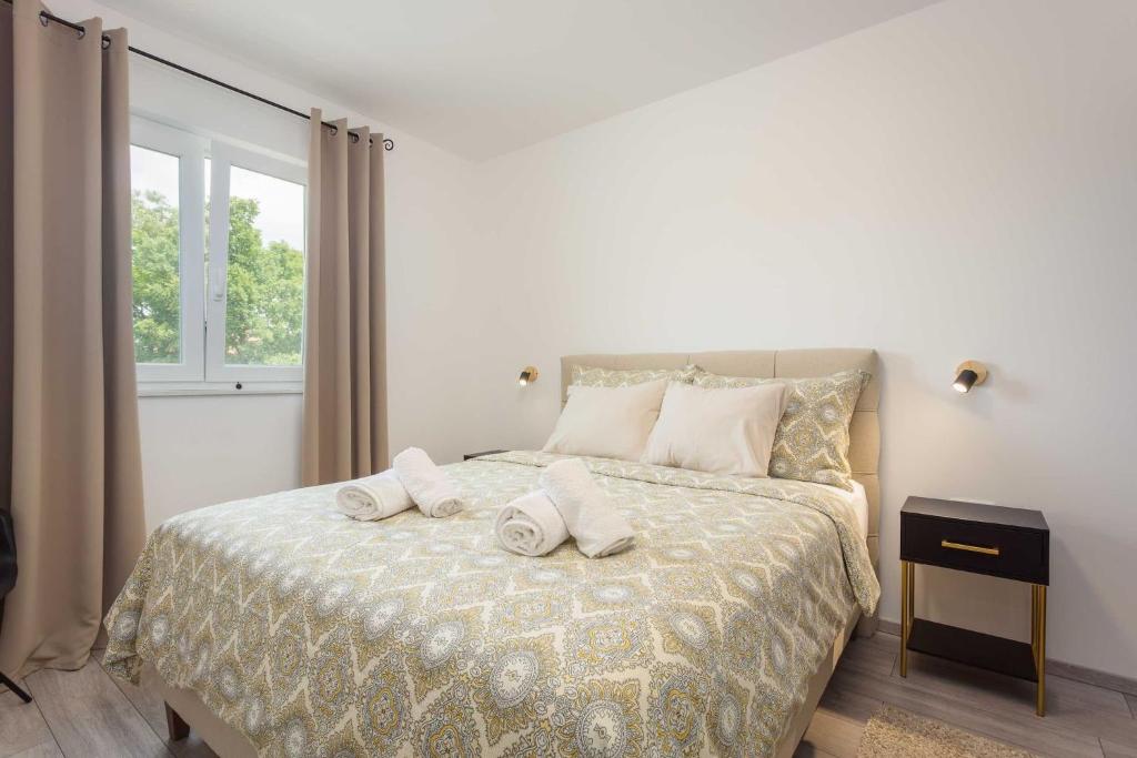 Posteľ alebo postele v izbe v ubytovaní Holiday Home Greta