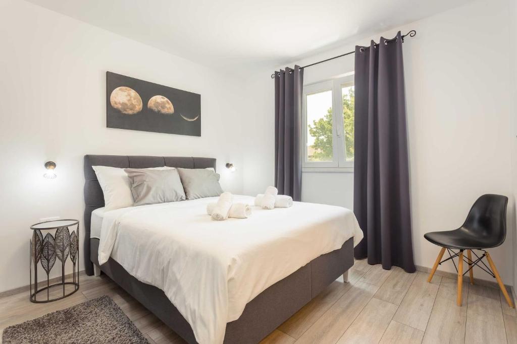 Posteľ alebo postele v izbe v ubytovaní Holiday Home Greta