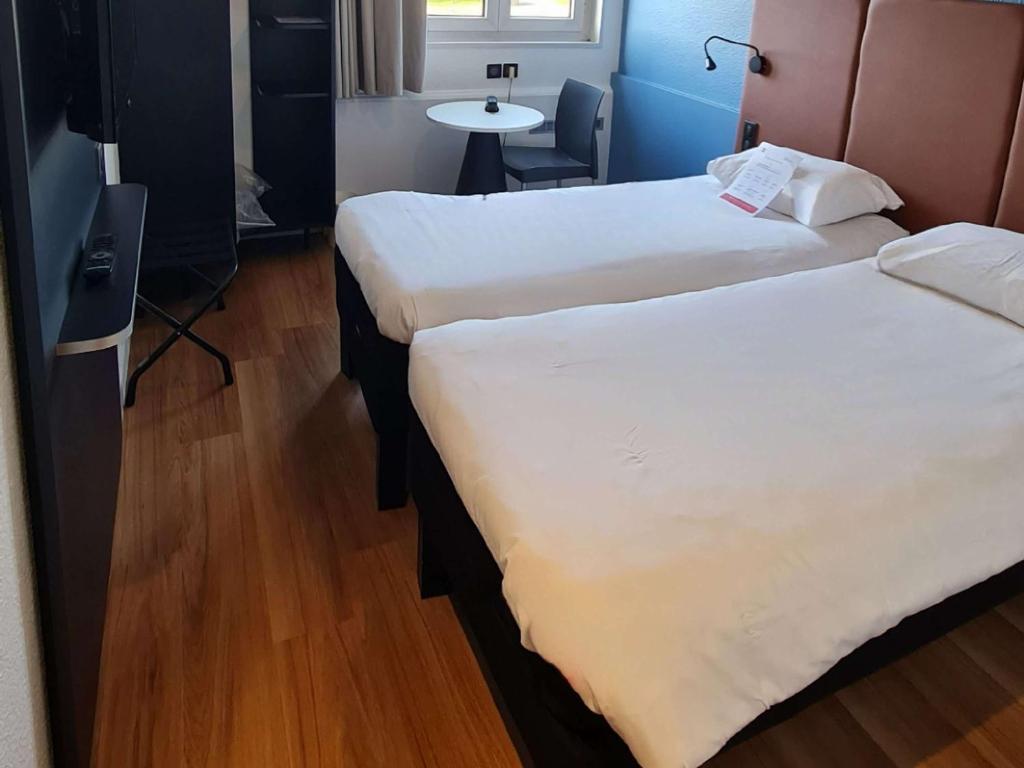 Postel nebo postele na pokoji v ubytování ibis Vannes