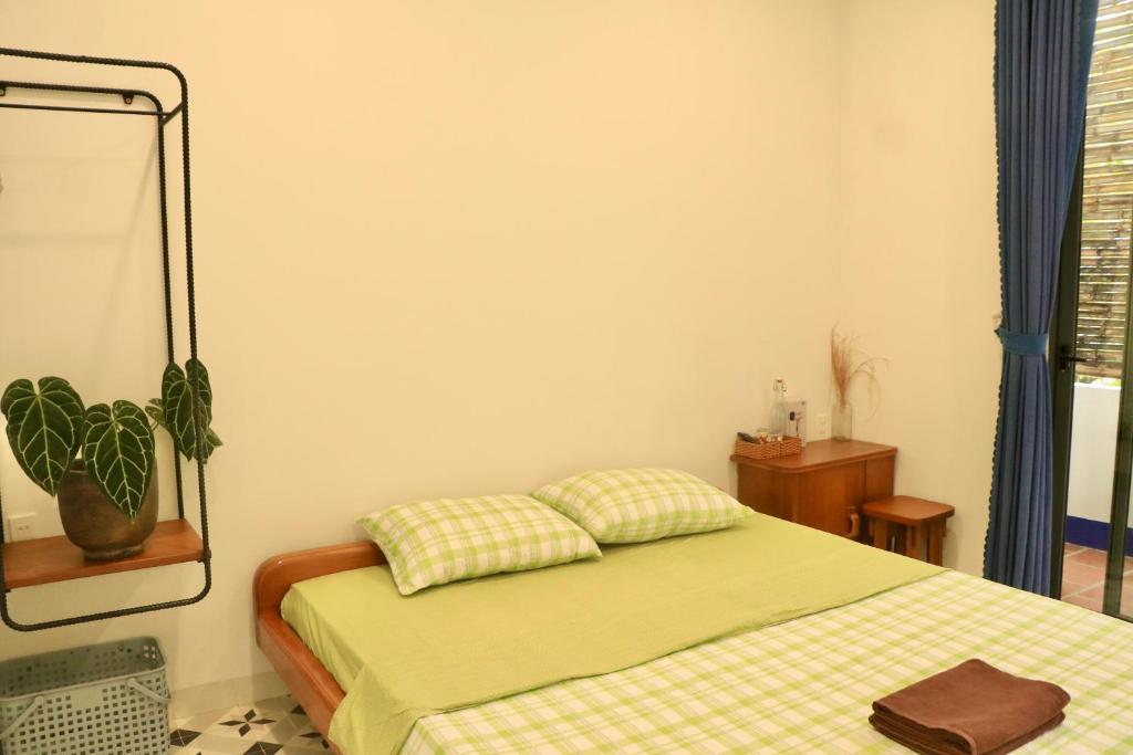 Postel nebo postele na pokoji v ubytování Sea For Rest Homestay