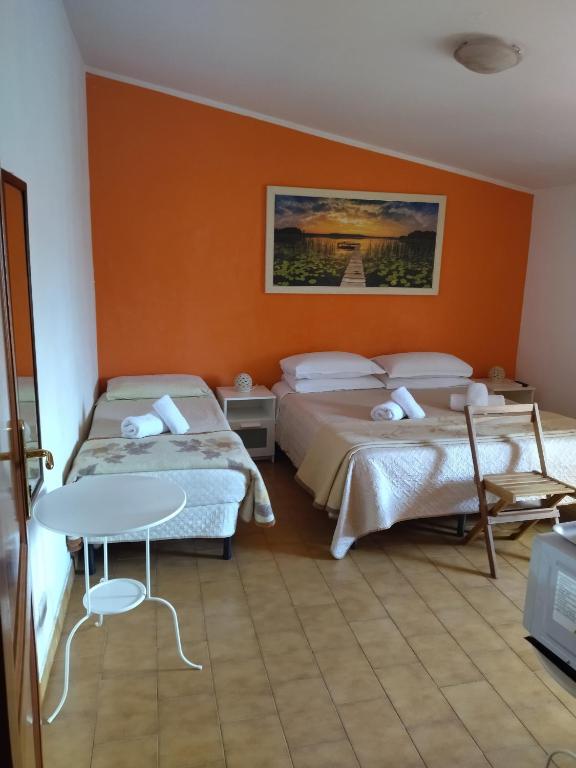 Postel nebo postele na pokoji v ubytování B&B La Pace Ardea