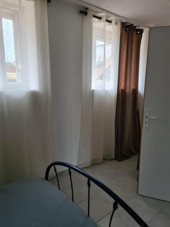Postel nebo postele na pokoji v ubytování Appartement T2 spacieux à FREHEL