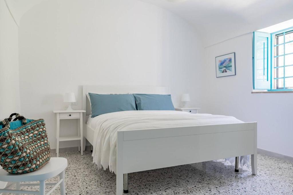 Postel nebo postele na pokoji v ubytování La casa di Maria - YourPlace Abruzzo