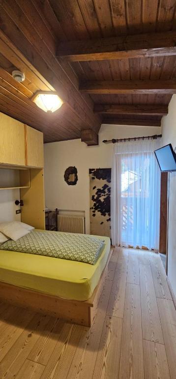 Postel nebo postele na pokoji v ubytování Hotel Camoscio