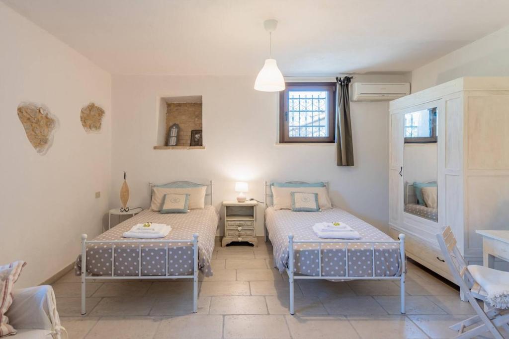 Postel nebo postele na pokoji v ubytování Il fico nel Pozzo - YourPlace Abruzzo