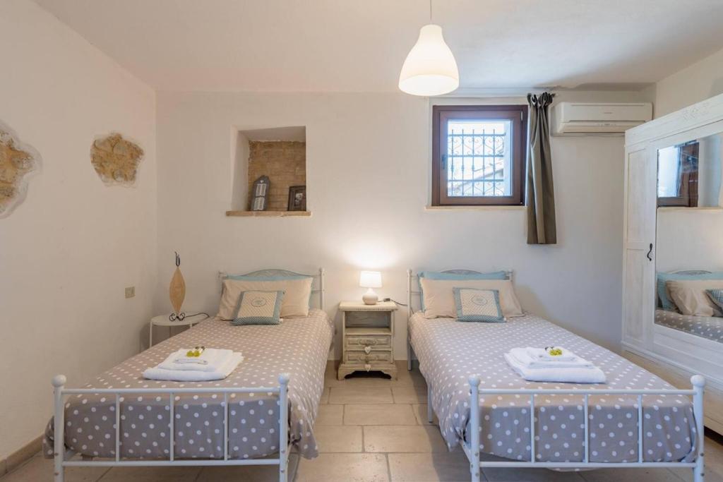 Postel nebo postele na pokoji v ubytování Il fico nel Pozzo - YourPlace Abruzzo