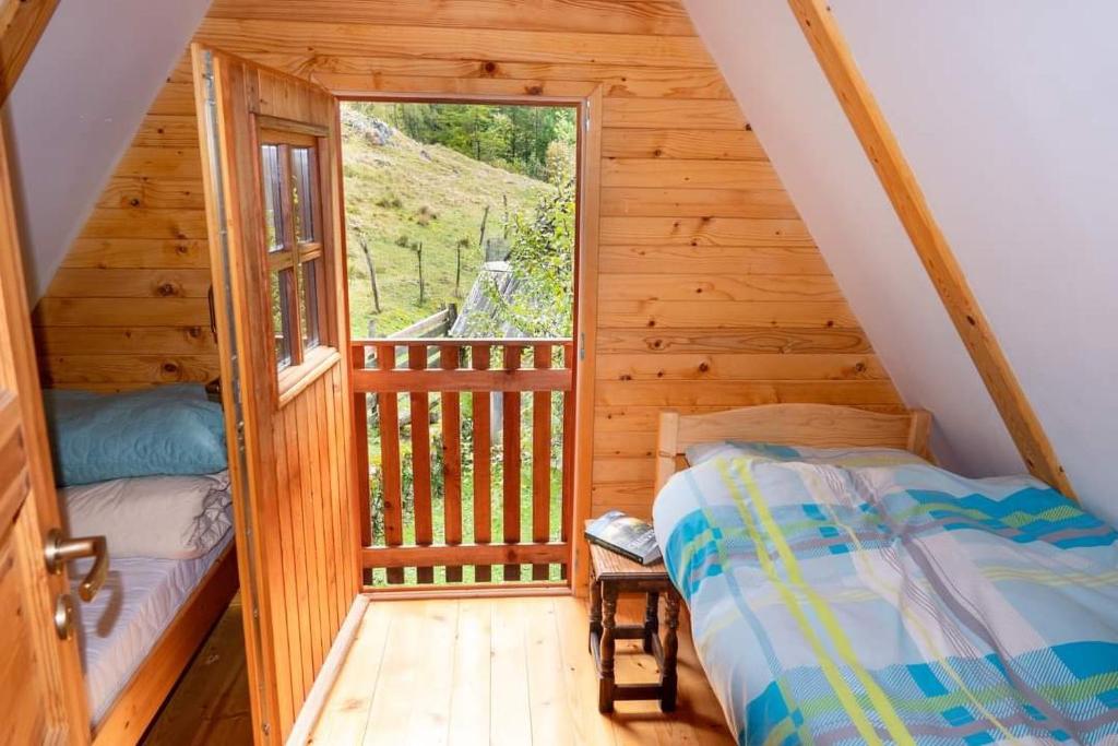 Postel nebo postele na pokoji v ubytování Cottages Kravanja