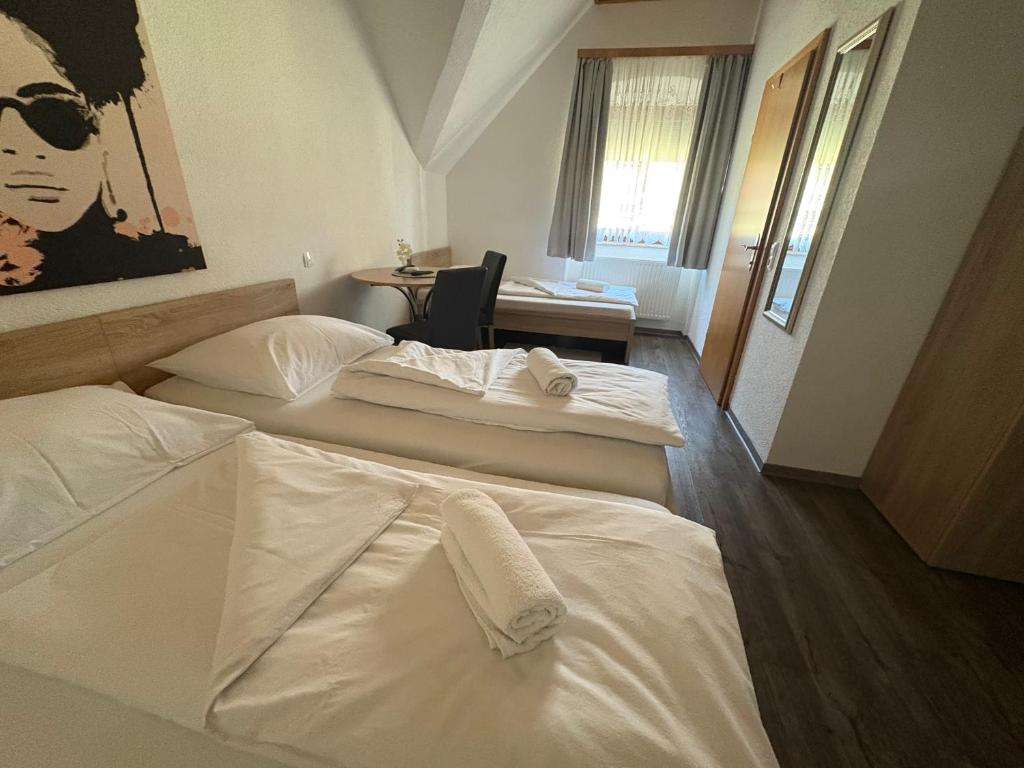 Postel nebo postele na pokoji v ubytování Gasthof Knezevic