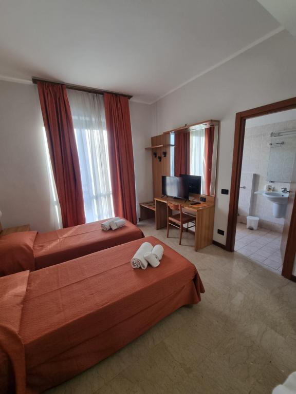 Postel nebo postele na pokoji v ubytování Aba Hotel