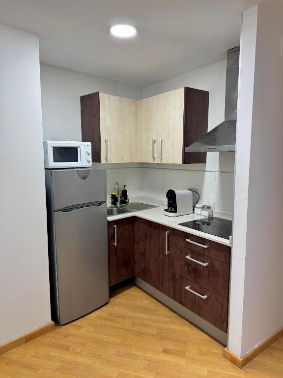 Kuchyň nebo kuchyňský kout v ubytování Wave Apartments