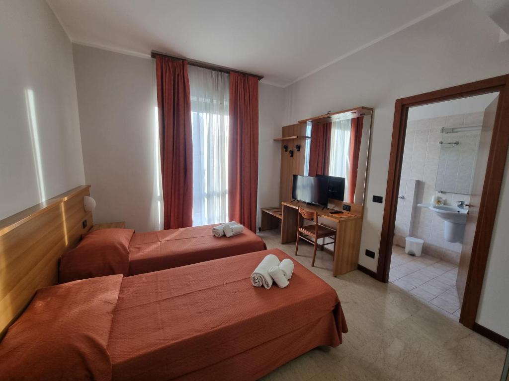 Postel nebo postele na pokoji v ubytování Aba Hotel