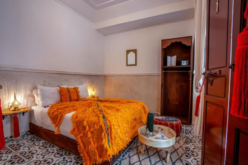 Postel nebo postele na pokoji v ubytování Riad Les Dunes And SPA