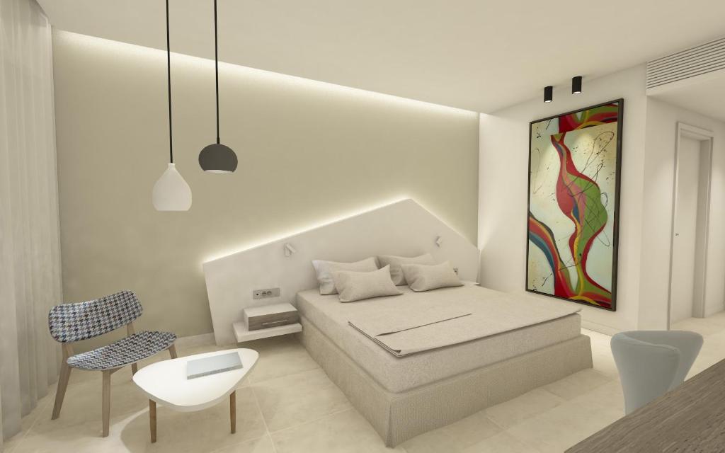 Postel nebo postele na pokoji v ubytování Kassandra Bay Resort, Suites & Spa
