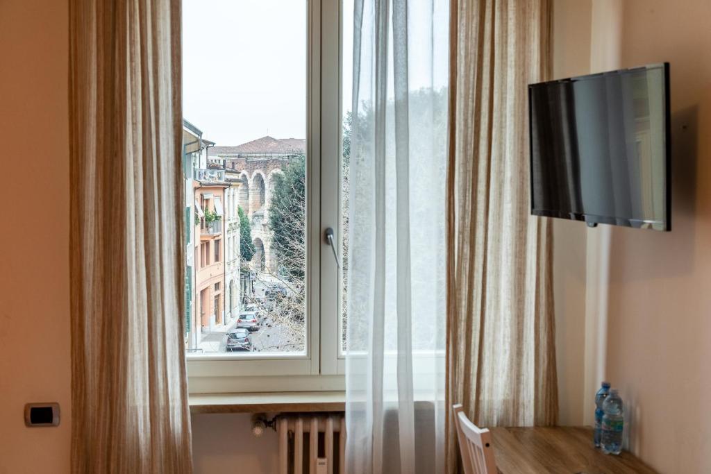Televízia a/alebo spoločenská miestnosť v ubytovaní Casa Vivaldi Guest House