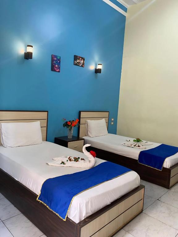 Postel nebo postele na pokoji v ubytování Hostgram Hotel
