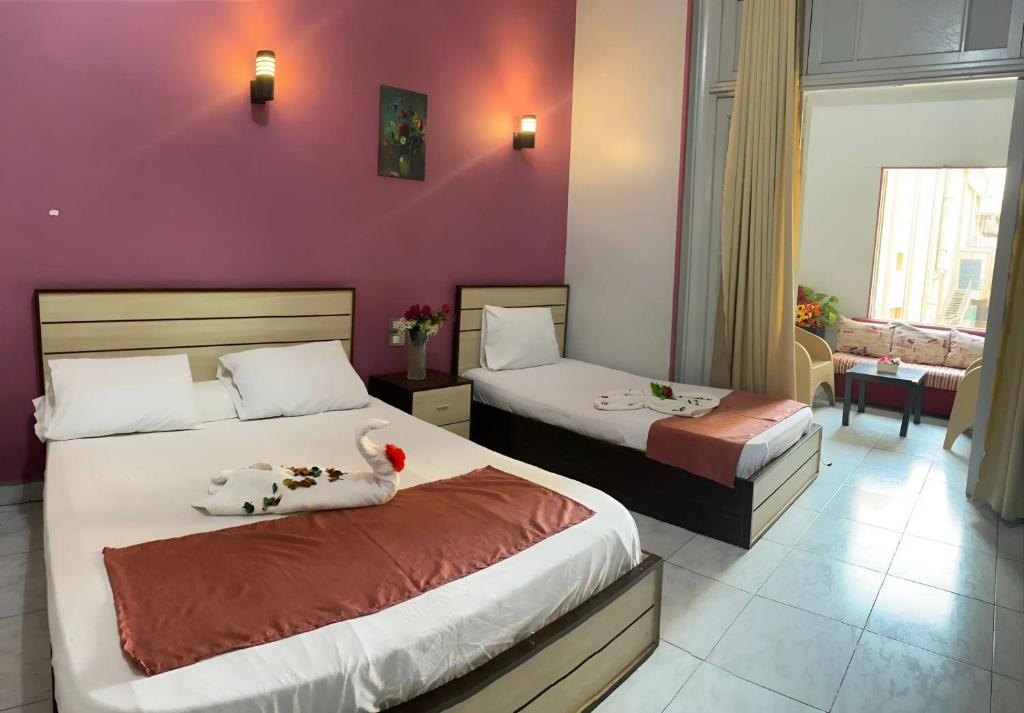 Postel nebo postele na pokoji v ubytování Hostgram Hotel