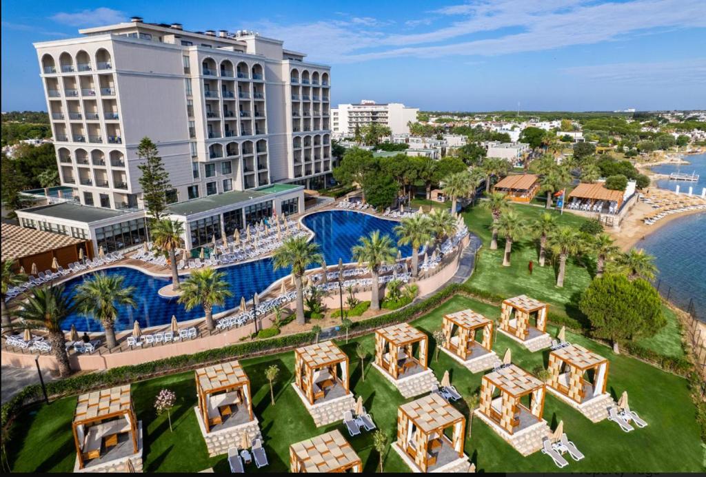 an aerial view of a resort with a pool and buildings at Duja Didim - Ultra All Inclusive in Didim