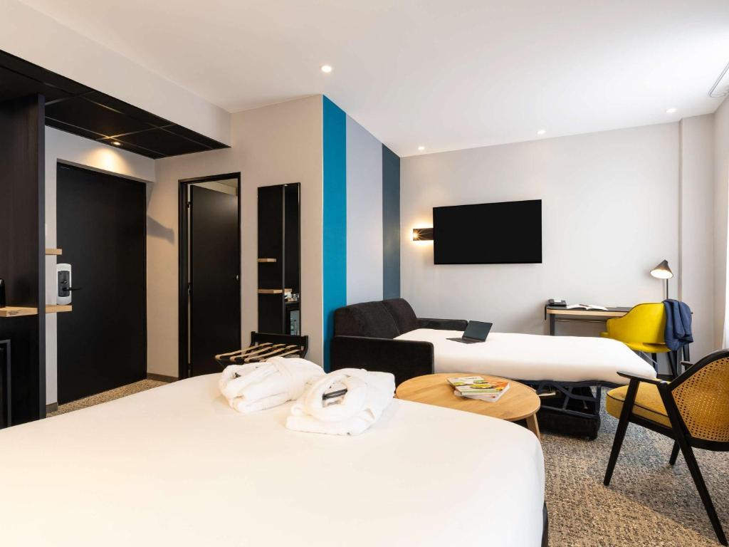 Postel nebo postele na pokoji v ubytování Mercure Epinal Centre