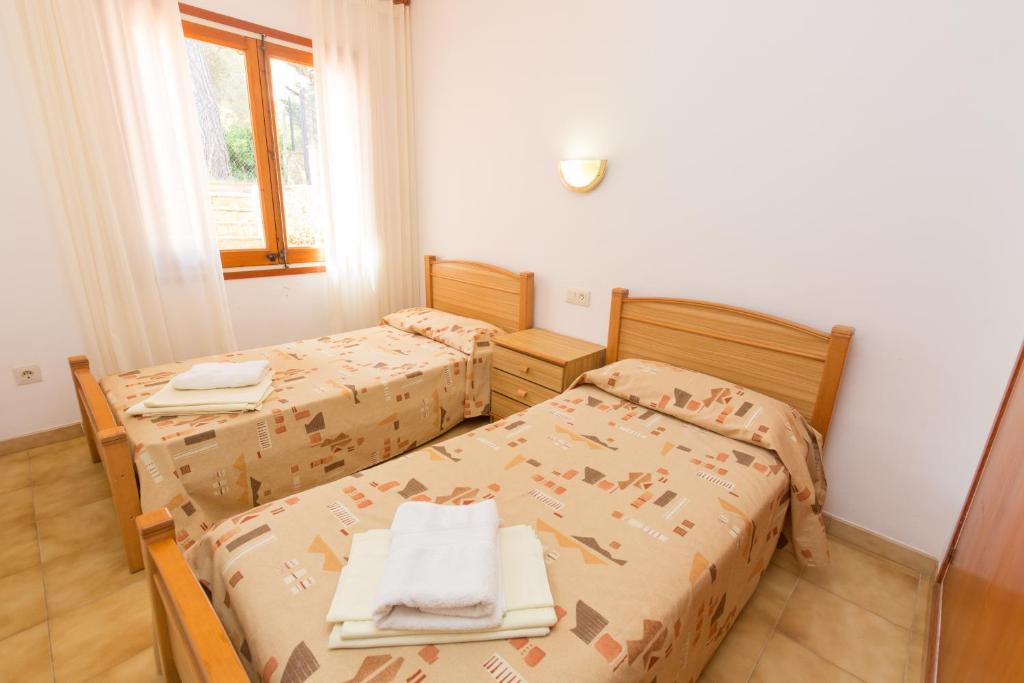 Postel nebo postele na pokoji v ubytování ISERN DALT 3H