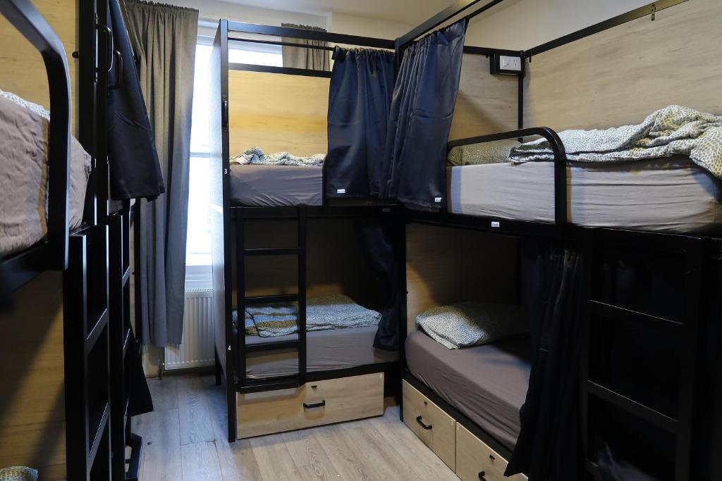 Postel nebo postele na pokoji v ubytování Onefam Notting Hill
