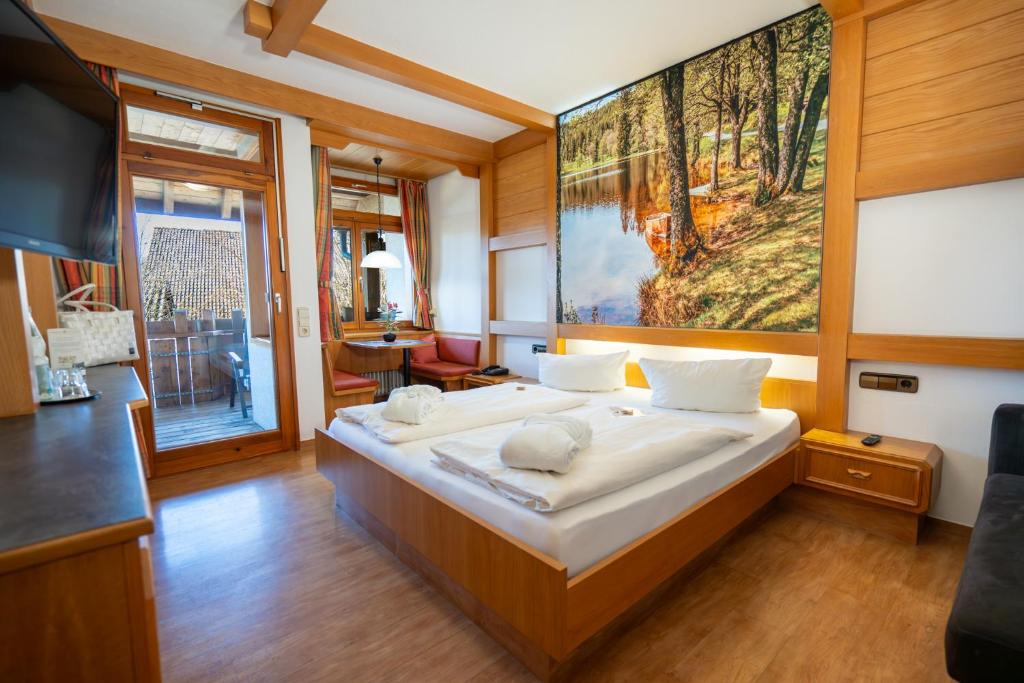 Postel nebo postele na pokoji v ubytování Wellnesshotel Sonnenhof & Sonnhalde