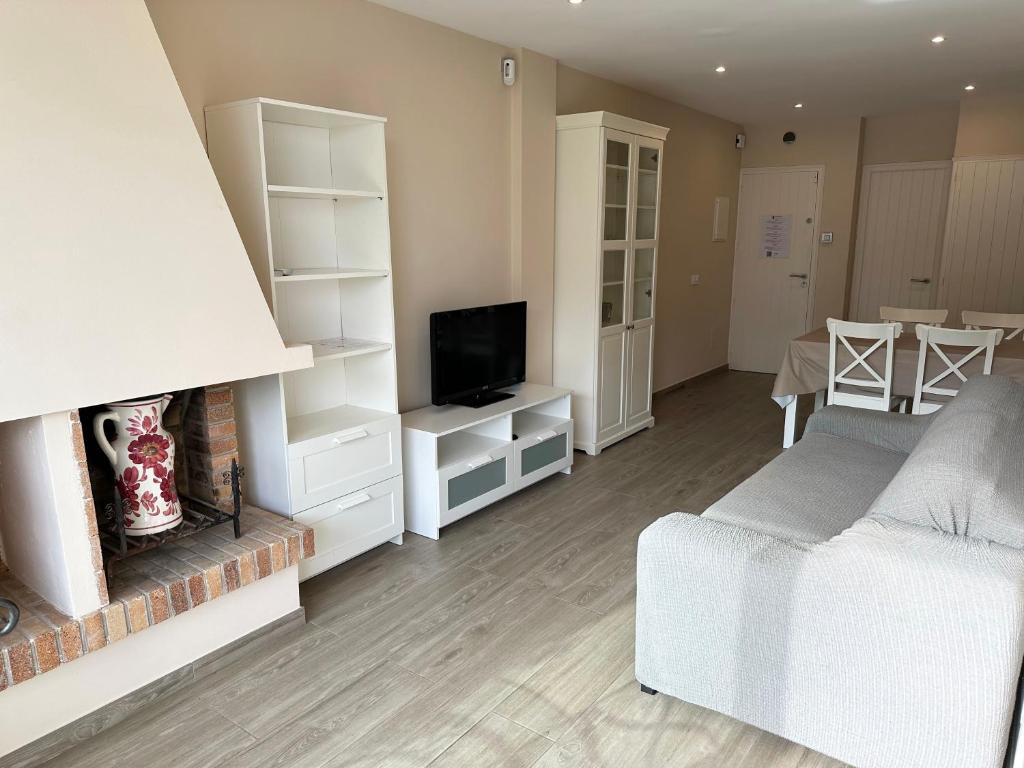 a living room with a bed and a fireplace at Paraiso 2 dormitorios en primera linea de mar - 333 in Pals