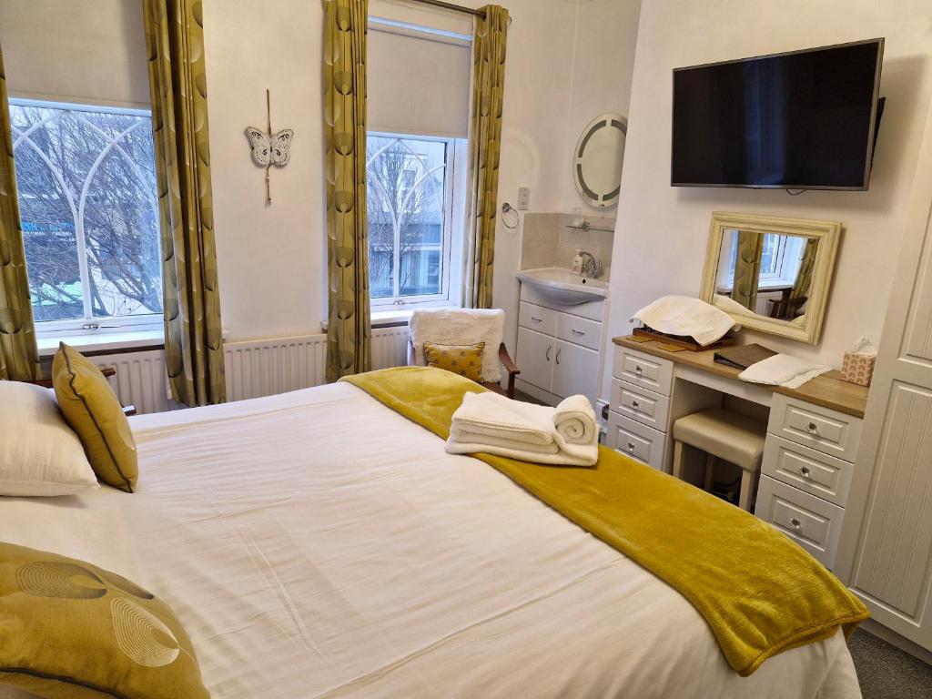 Postel nebo postele na pokoji v ubytování Forest Guest House