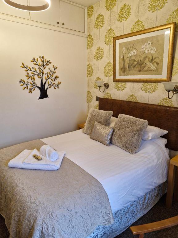 Postel nebo postele na pokoji v ubytování Forest Guest House