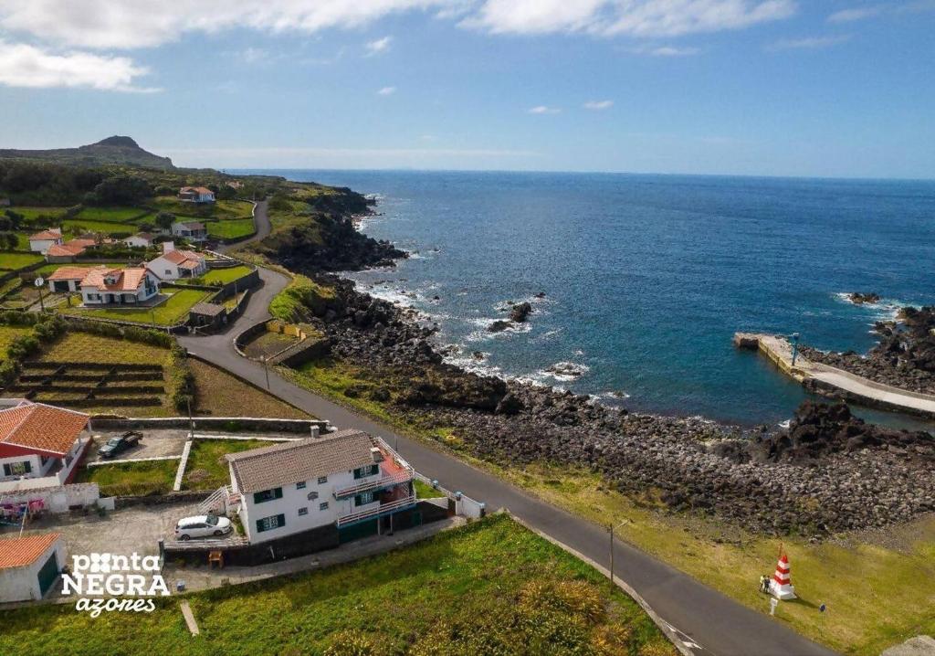 an aerial view of the ocean and a road at Casa da Maresia by PontaNegraAzores in Biscoitos