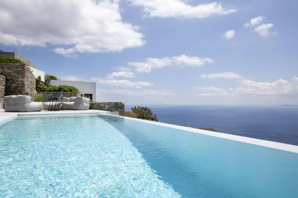 a swimming pool with a view of the ocean at House G in Kardiani Tinos in Kardiani