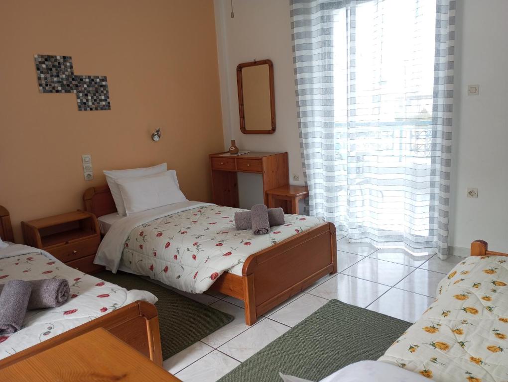 Postel nebo postele na pokoji v ubytování Ero Aegina Hospitality
