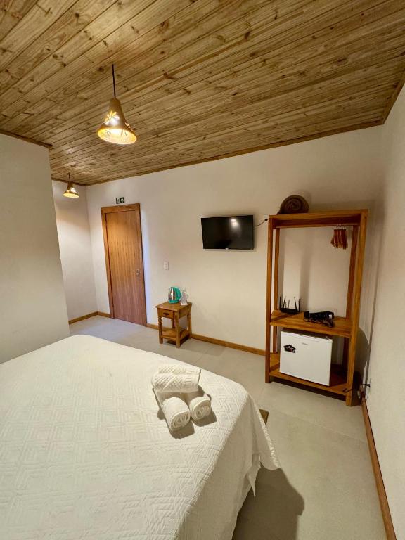 Postel nebo postele na pokoji v ubytování Caraíva Suítes