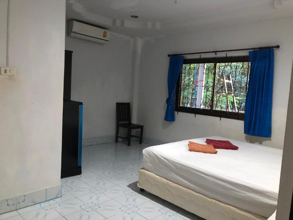 Postel nebo postele na pokoji v ubytování Secret Lanta Guesthouse