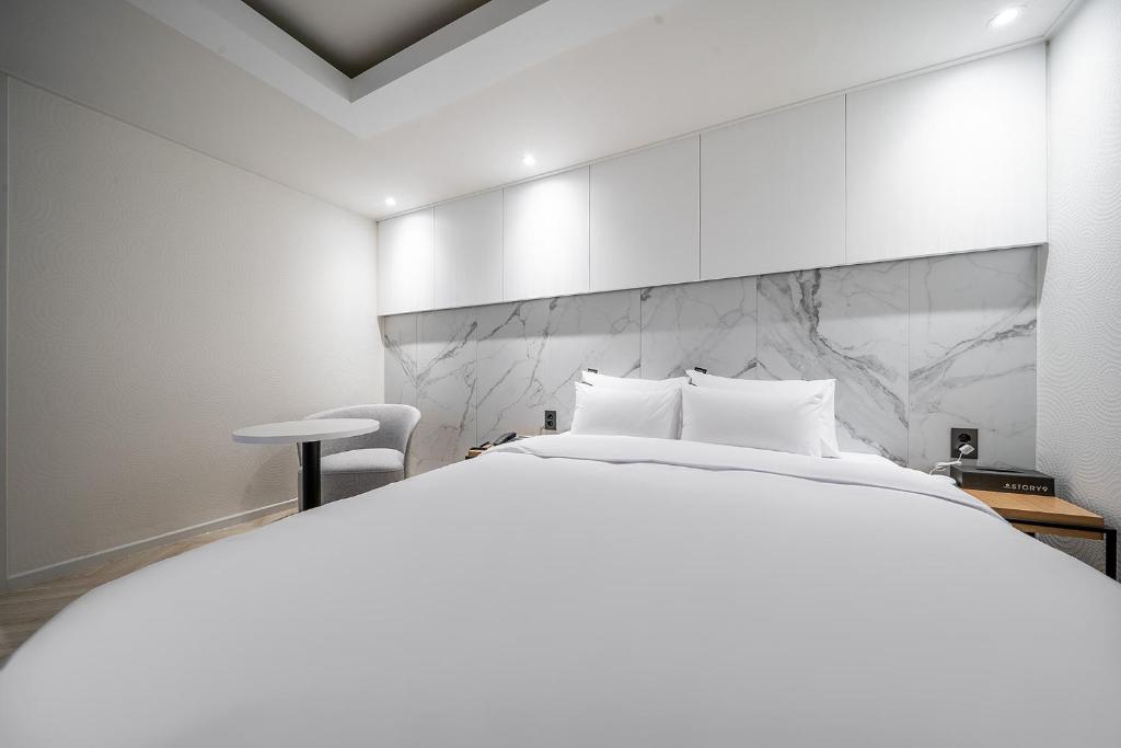 Postel nebo postele na pokoji v ubytování Story 9 Hotel