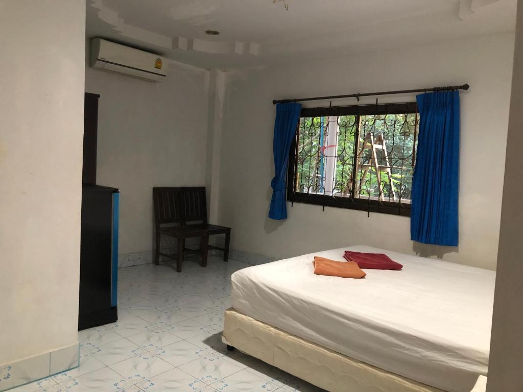 Postel nebo postele na pokoji v ubytování Secret Lanta Guesthouse