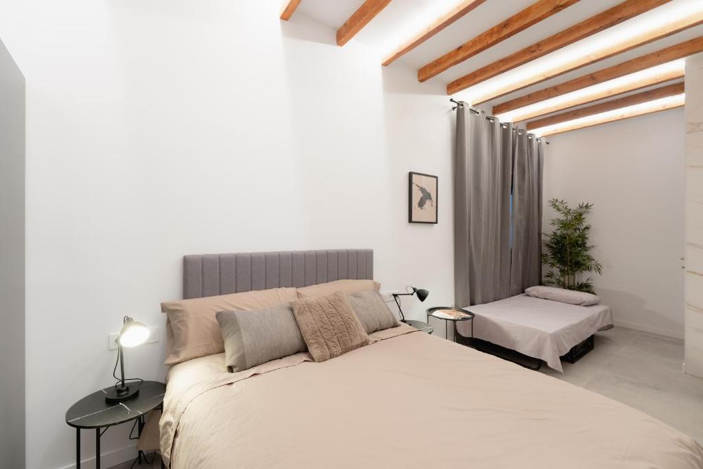 En eller flere senge i et værelse på Alojamiento Casa Liam 2