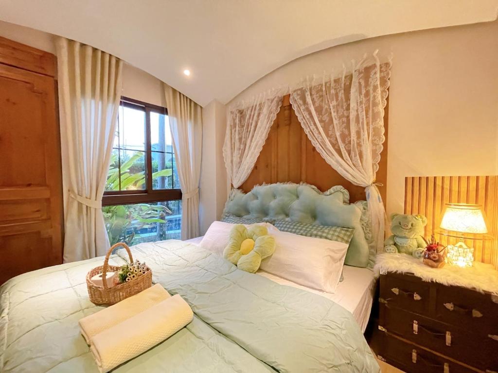 Postel nebo postele na pokoji v ubytování Venetian Signature Pattaya